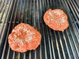 Mama Patierno's Italian Pizza Burger Recipe image of 2 Burgers on the grill