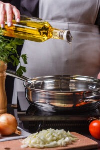 Generic Chef adds or pours Oil to the Pan / Pot