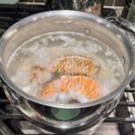 15 Minute Organic Lobster Bolognese Recipe - image of lobster boiling in pot